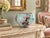 A charming early 20th-century porcelain rose bowl featuring a softly rounded, bulbous form and a deeply scalloped opening...