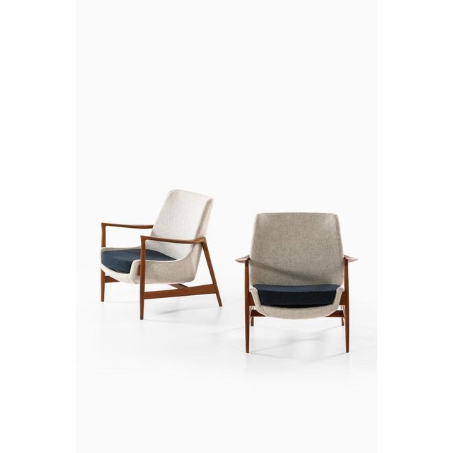 This very rare pair of easy chairs, model 4346, designed by ib kofod-larsen and produced by fritz hansen in denmark during...