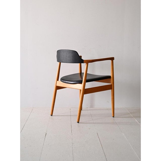 Chair with teak and original vintage eco -leather armrests. 60s. Made with a fine teak structure, the conical legs give a...