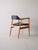Chair with teak and original vintage eco -leather armrests. 60s. Made with a fine teak structure, the conical legs give a...