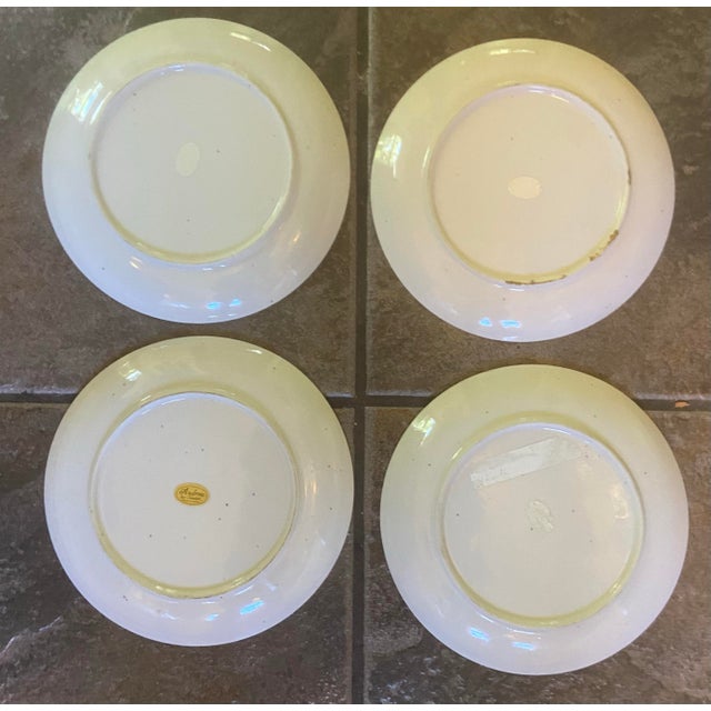 A charming set of four vintage Andrea by Sadek porcelain plates featuring beautifully rendered game bird illustrations,...