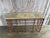 An exceptional rustic stone console table featuring a substantial textured stone top paired with an architectural hand-...