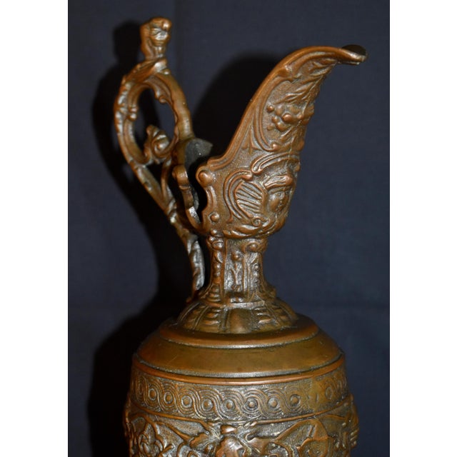 Antique early 1900's Ewer- Urn - Pitcher has a Victorian Style. Bronze. Figural & Grape Motif. The Measurements: 4" x...