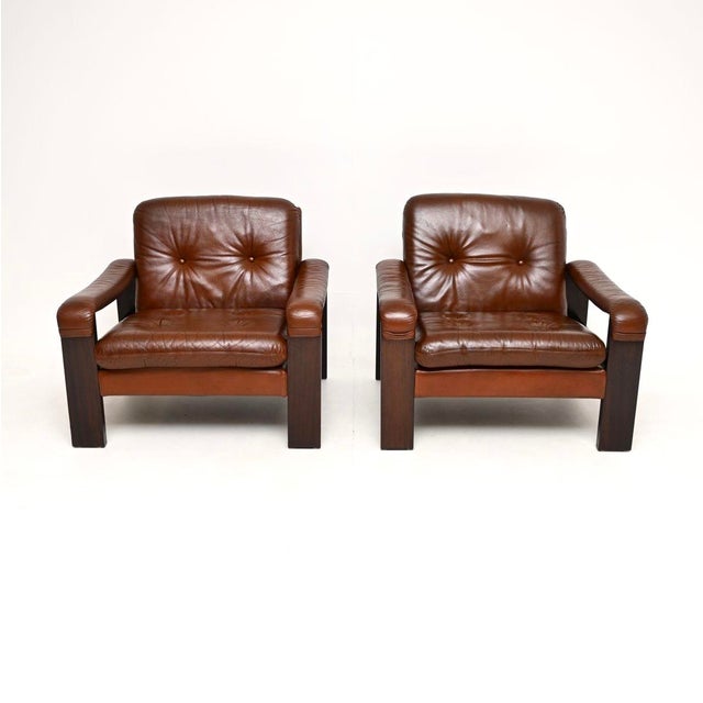 A stylish and very comfortable pair of vintage Danish leather armchairs. They were recently imported from Denmark, they...