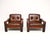 A stylish and very comfortable pair of vintage Danish leather armchairs. They were recently imported from Denmark, they...