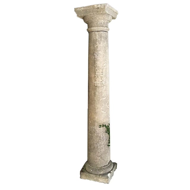 Pair of antique 18th century French limestone doric columns. Some chipping around the top and bases. The shafts measure...