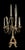 . Oversized wrought iron candelabra . Three tier set into each other . Displays 15 candles, each holder adorned with a...