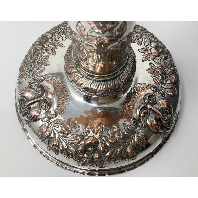 This silverplated candlestick is believed to be created by an enslaved highly skilled artisan. It features repousse...