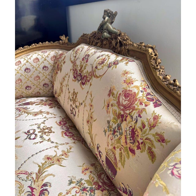 Elevate your living space with this stunning French Baroque-style sofa, featuring a timeless beige-white damask upholstery...