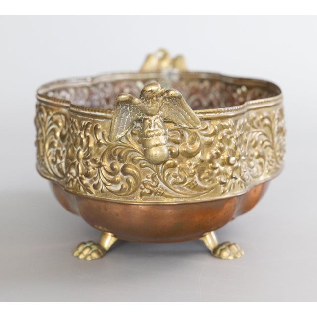 A gorgeous antique English brass and copper footed jardiniere / planter / cachepot, circa 1920. Maker's mark on reverse....