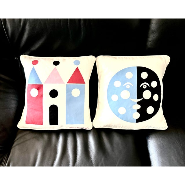 A rare matching pair of retired early-2000s modernist accent pillows featuring the iconic "House" and "Moon" graphic...