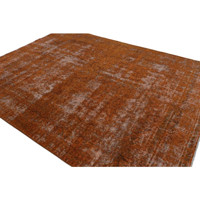 From our new collection of overdyed rugs, a vintage 9×12 Persian rug, hand-knotted in wool circa 1970-1980. On the Design:...