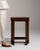 Carved walnut console table in Rich Walnut Brown. The rich walnut brown surface highlights fluted colonnade legs, simple...