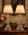 A charming pair of vintage crystal table lamps featuring heavily cut crystal bases, diamond-point faceted columns, and...