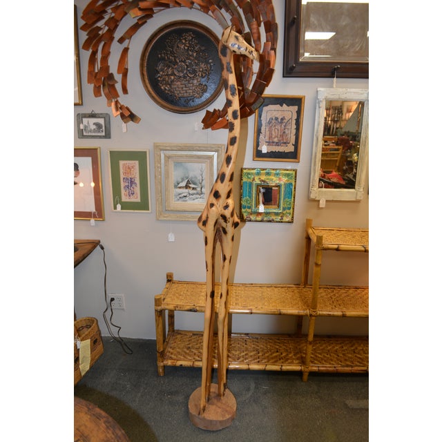 This solid wood, hand crafted, giraffe was shipped here in the 1980's. Sturdy & stands. Overall a golden color with a few...