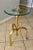 Italian tripod solid brass tripod side or end table with round glass top. The brass table has decorative unique features,...