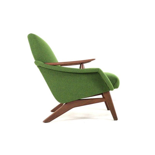A stunning combination of sleek lines and beautiful materials. This gorgeous armchair exudes timeless design and a high...