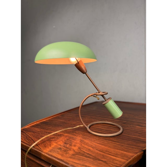 Rare early table lamp model Scrittoio 12297 designed by Angelo Lelii for Arredoluce in 1949. This elegant desk lamp...