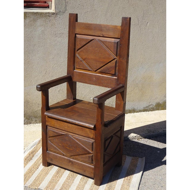 A charming armchair with a salt chest, crafted entirely from solid wood and fully pegged. The backrest is carved with a...