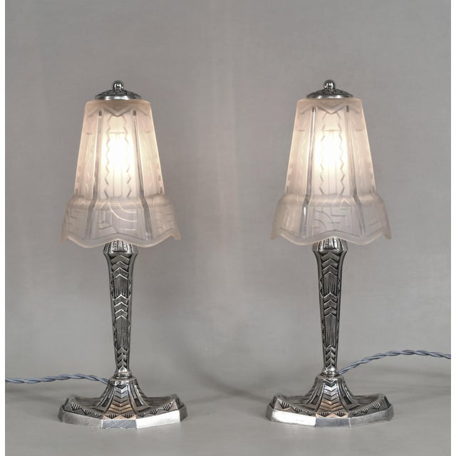 Pierre Maynadier A pair of French art deco lamps by Maynadier made circa 1930. The nickel-plated bronze or solid brass...