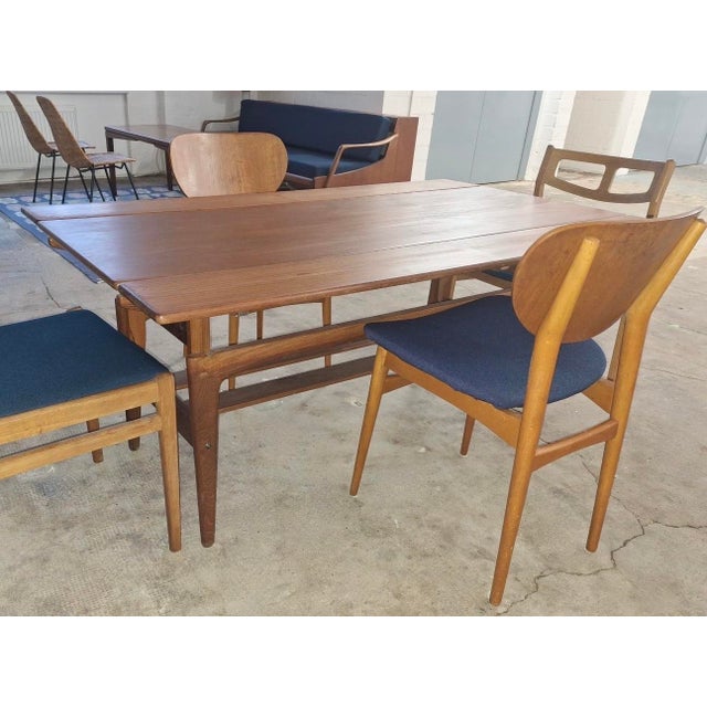 Trioh metamorphic dining / coffee table in teak, 1960s. Beautiful wood grain. The table is unusually large with a length...
