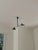 The iconic design of the Three Arm Multi-Light Pendant by Serge Mouille lends a striking presence in a modern home....