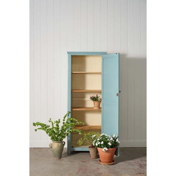Early 20th century English pine cabinet with beautifully weathered blue paint, warm patina, two paneled doors, and...