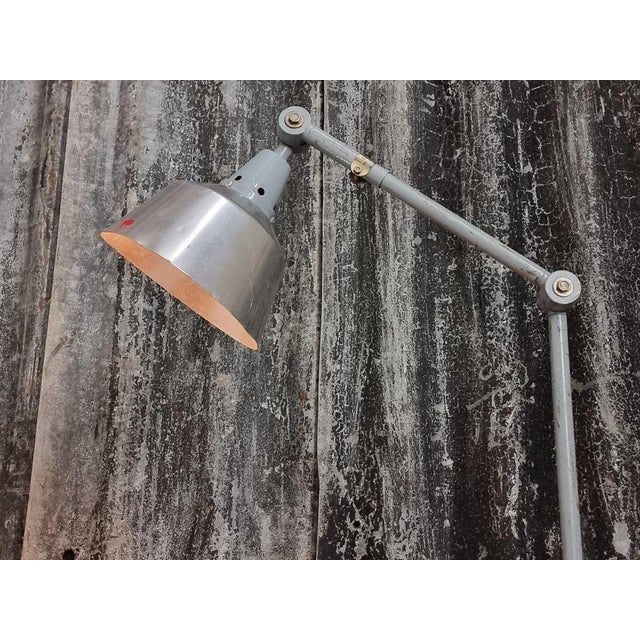 Vintage lamp Midgard Kahla from Germany from the 1960s. This old work lamp was designed by Curt Fisher. This iron lamp has...