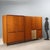 Vintage wardrobe with hinged doors and drawers with teak wood veneer and laminate inserts. Decent condition. This piece is...