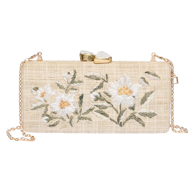 The ALESSANDRA Long clutch is a celebration of summer elegance, crafted from natural raffia and delicately hand-...