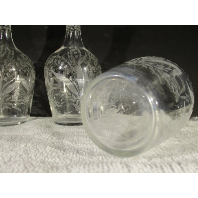 Antique set of 3 liqueur decanters from Czechoslovakia. Lily of the Valley pattern hand-cut into each decanteur and each...