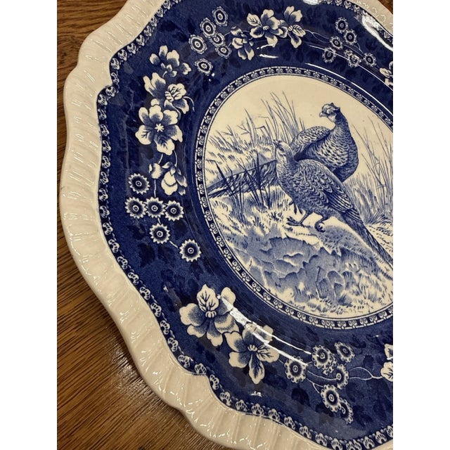 The vintage Spode Pheasants blue-and-white transferware plate is a genuine piece of English pottery. Crafted from...