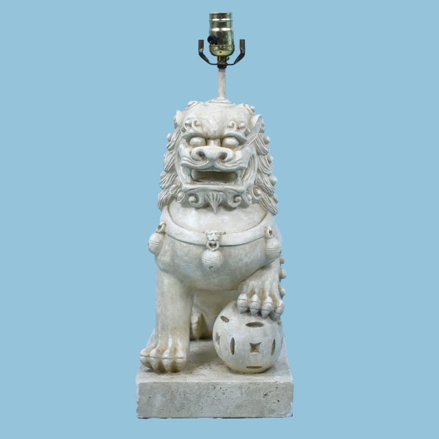 A single foo dog table lamp with guardian-lion charm and undeniable chinoiserie presence. The glazed ceramic body anchors...