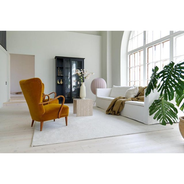 A wonderful pair of wingback chairs made in Sweden during the 1940s. The shape and structure together with the wooden...