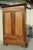 Each door consists of a single board of elm or ash. This large laundry cabinet was produced in the late 19th century. It...