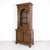 A fine early 19th century French Empire period bibliothèque or bookcase handcrafted of select walnut by talented artisans...