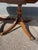 Beautiful circa 1920s antique mahogany dining table, featuring a classic English Regency / Duncan Phyfe-inspired design....