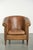 This rugged, well-worn vintage sheepskin club chair offers a comfortable seat and a beautiful color. The chair is crafted...