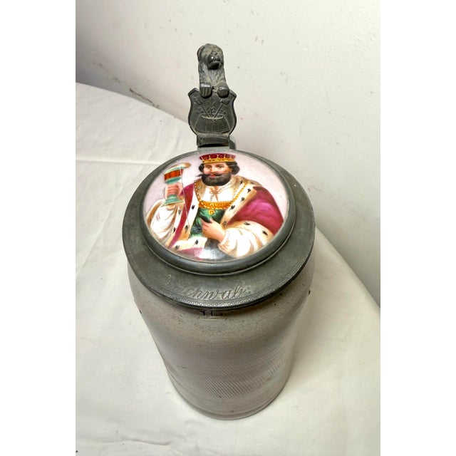 Up for sale is a high quality antique lidded German pottery beer stein made in the first quarter of the 19th century. It's...