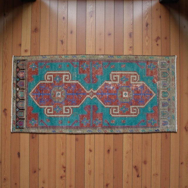This vibrant vintage Denizli Chal rug features a striking geometric medallion design in rich turquoise and terracotta...