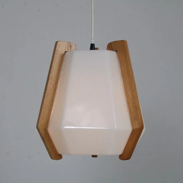 A beautiful hanging lamp designed by Rudolf Döffler, manufactured in Germany around 1970. I have official proof of...