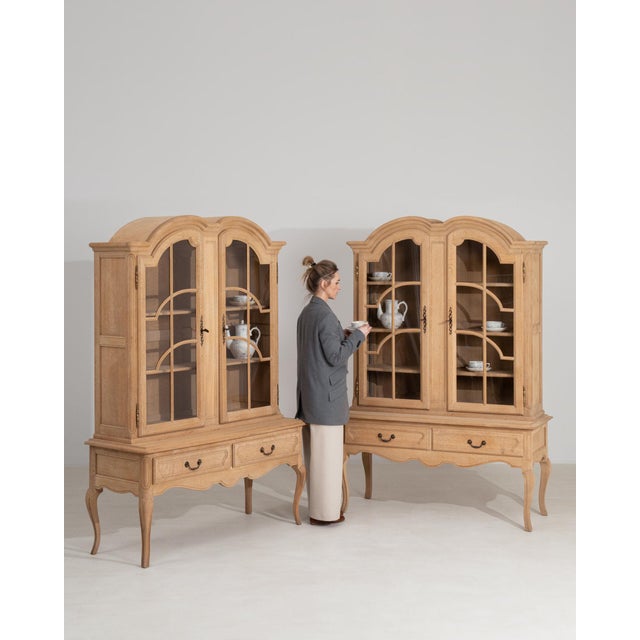 Here is a piece, its natural bleached oak, arched pediment the first thing to catch the eye. Originating in France during...