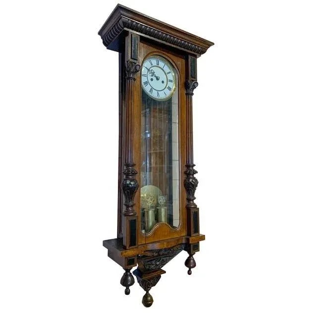 Antique Wall clock with Hand Carved case. In working order, however, missing second hand. Wind-up mechanism, key is...