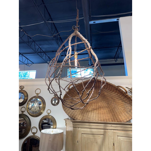 Spanish twig hanging light. Made with organic twisted vines. 30”l x 18”d x 46”h 48-008