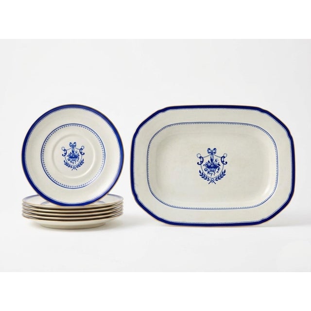 A charming vintage porcelain serving set, showcasing a timeless Neoclassical aesthetic. Featuring a white base accented by...