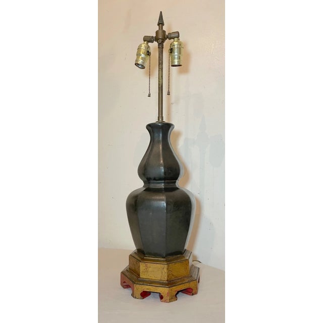 Add a touch of elegance to your home decor with this beautifully large vintage Chinese pottery table lamp. The dark green...
