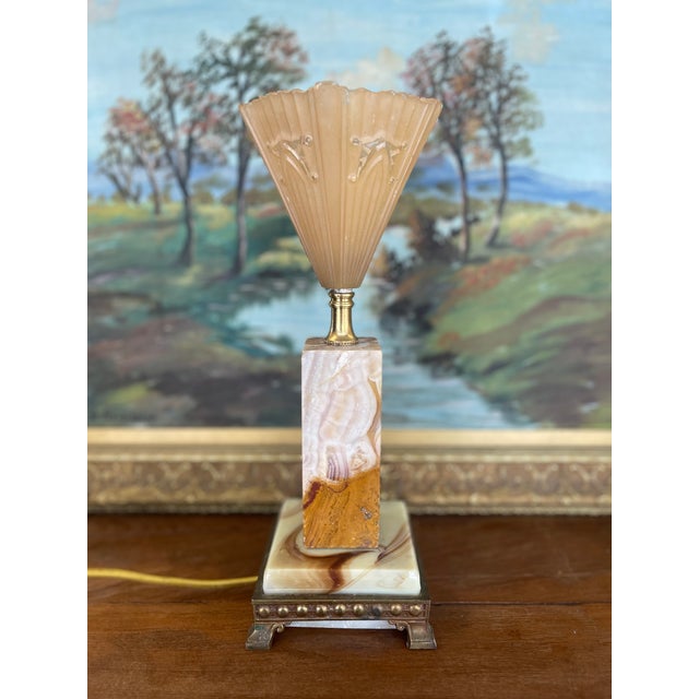 A striking table lamp possibly French Art Deco dating from the 1930s, this piece features a bold architectural form with...