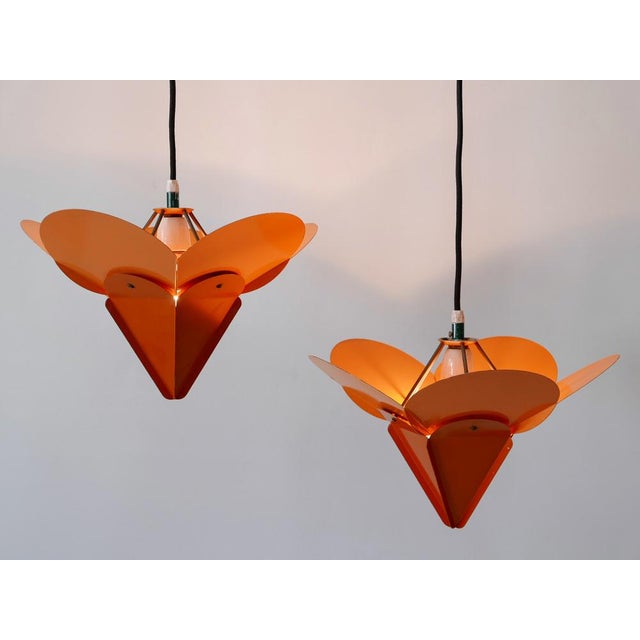 Set of two extremely rare, elegant and highly decorative mid-century modern bi-colored metal tivoli flower pendant lamps...