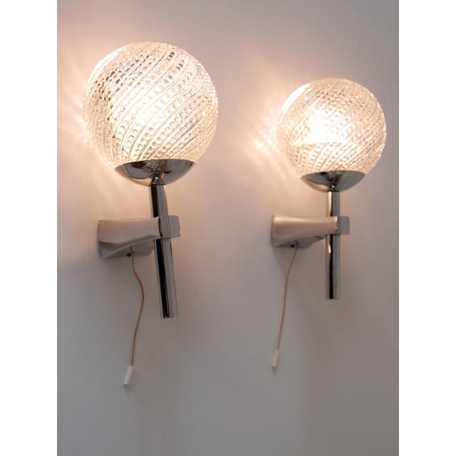 Set of two elegant mid-century modern sconces or wall lights. Designed & manufactured in germany, 1970s. executed in...
