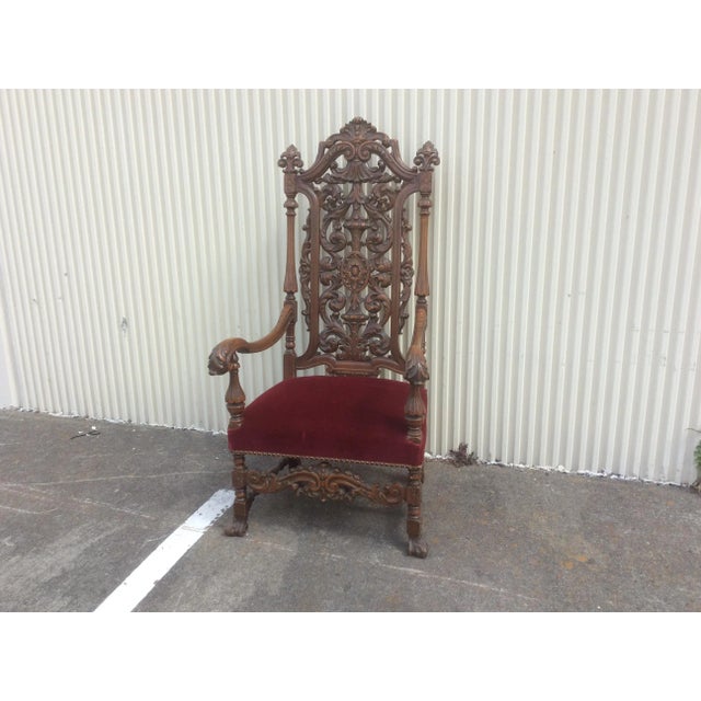 Charming highly carved throne chair that works as an library chair, desk chair or occasional chair also a dining chair